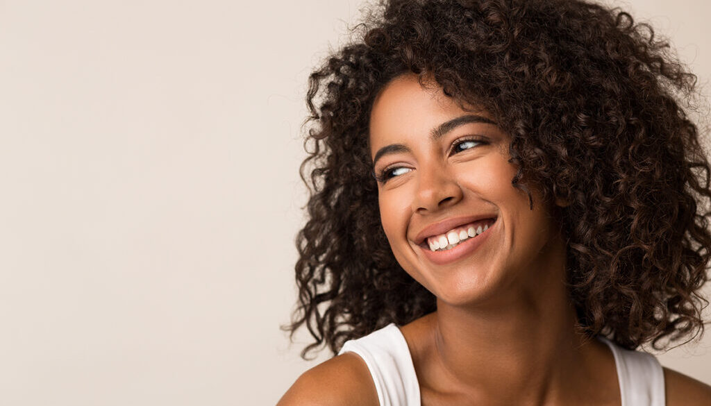 Beauty,Portrait,Of,Happy,Black,Woman,On,Light,Background